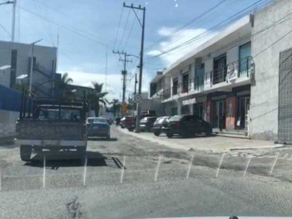 Inundan baches las calles de Cuautlancingo